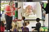  Preschool teacher Lori Brown, left, poses a question to Kyra Conrad, 4, who was using FaceTime to interact with her classmates Wednesday afternoon at Danbury Elementary in Marblehead. For two hours each day, Kyra uses an iPad to FaceTime with her class.