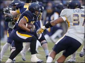 UT-spring-game-DJ-M.jpg Toledo Rockets blue team running back Damion Jones-Moore picks up yardage.