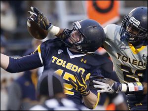 UT-spring-game-Juwan-Haynes.jpg Toledo Rockets gold team cornerback Juwan Haynes, 20, breaks up a pass intended for blue team tight end Craig Runyan.