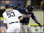 The Tigers’ Joaquin Benoit (53) tags out the Indians' Asdrubal Cabrera at first base on Friday.
