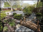  Jim Stark walks across the labyrinth in the garden of his late wife, Norma Stark, in Perrysburg  The garden was built for meditation, in memory of Norma's parents, Norman and Anna Belle Swaisgood.  Norma died in 2011. The garden is maintained by the Norma Stark Memory Garden and Labyrinth Foundation.  Jim lives at the home. 