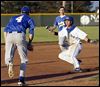  AW's Austin Kottenbrock gets caught in a pickle between Findlay pitcher Nolan Atwood(4) and SS Austin Powell (2) during the first inning  of a D-I sectional game on Thursday in Bowling Green.