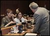  Denise Fox of Aurora House, left, and Renee Palacios of Family House speak with Toledo City Council member George Sarantou at Thursday’s meeting on funding.