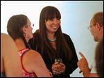  Matika Wilbur, center, greets attendees of her talk after speaking about her experiences photographing Native Americans during a lecture.
