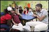  Donovan Vaughn, 15,  interacts with students at the Creative Village Child Devel-opment Center in Toledo as part of the Student African American Brotherhood.