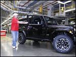  Dan Henneman, Jeep unit chairman of UAW Local 12, gets out of the one-millionth Jeep Wrangler JK model that rolls off the assembly line at Chrysler Toledo Assembly Complex.