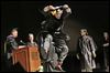  Zander Epps of San Diego jumps as he crosses the stage to receive his bachelor’s degree in interdisciplinary studies during Lourdes University’s commencement ceremony.