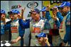  Ken Schrader, center, celebrates in Victory Lane after claiming the Menards 200 on Sunday afternoon at Toledo Speedway. It was the first ARCA start of the season for the longtime driver.