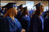  Phylicia Cattladge of South Toledo, center, waits with her fellow graduates backstage before the start of the commencement ceremony for students in the Adult Basic and Literacy Education program today at the Center for Fine and Performing Arts at Owens Community College in Perrysburg Township.