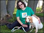  Jody Brickner of Findlay  with Ruthie. Mrs. Brickner was fostering Ruthie and ended up keeping the 15-year-old  Brittany spaniel after the dog recovered from heartworm disease.