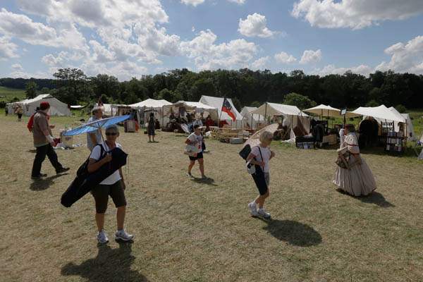 Gettysburg-150th-AnniversarySpectators-go-to-a-reenactment-shop-in-a-tent-city
