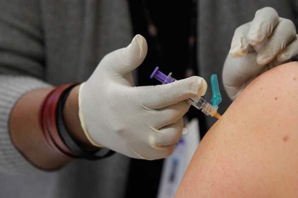 A-woman-receives-a-flu-shot