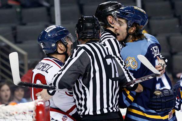 Toledo-s-Tyler-Elbrecht-and-South-Carolina-s-Dale-Mitchell-are-separated-by-referees