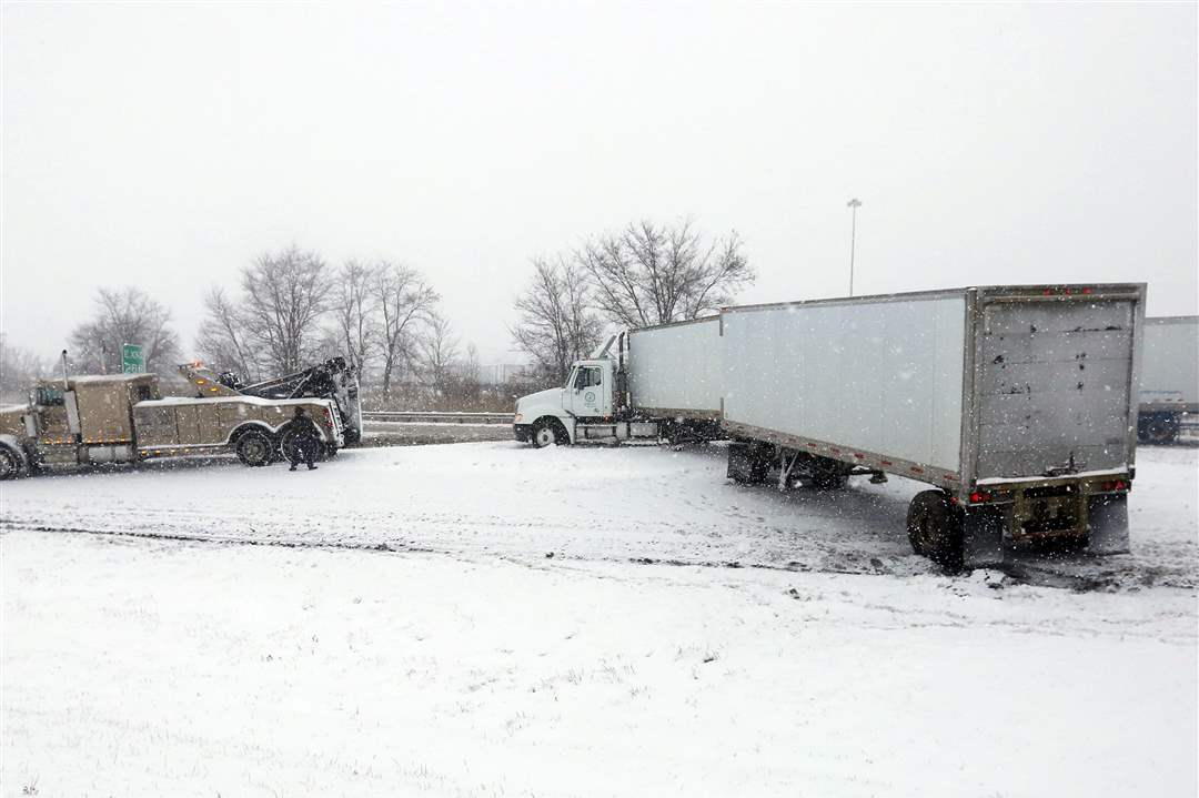 CTY-weather12p-semi-and-tow-truck