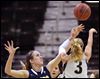 s6block.jpg Toledo's Olivia Braun blocks a shot by Akron's Kacie Cassell in the second half on Thursday. UT likely ended its season at 16-16.