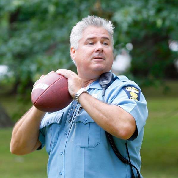 CTY-picnic29p-officer-below-football