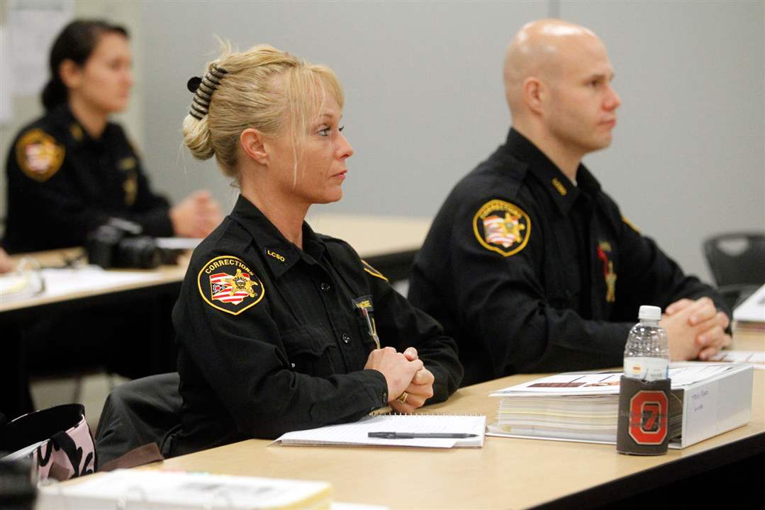 CTY-DEPUTIES23pLucas-County-Corrections-Officer-Trish-Moore-listens