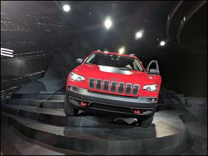 The new Jeep Cherokee features an updated front fascia, along with a redesigned back lift gate, wider rear cargo area, and some minor interior tweaks. 